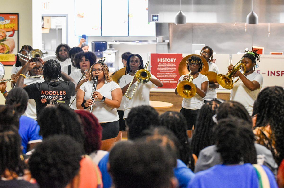 Students gather around as Dillard Universitys Pep Band performs at the  Involvement Fair on Aug. 16 in the Student Union.