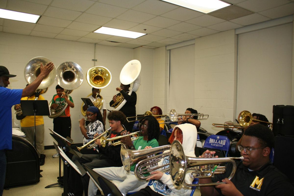 Dillard University students and students from McMaine Secondar School practice their instruments in Dent Hall.