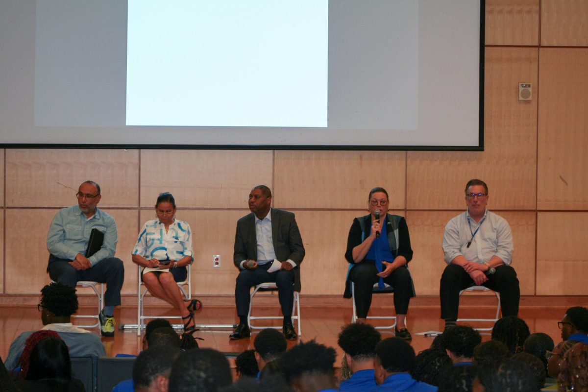 Campus administators answer questions from students at the Town Hall.