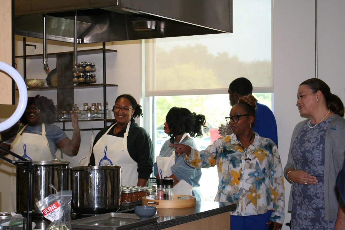 Dr. Monique Guillory, Ph.D., receives a tour of the Ray Charles Program kitchen in the Professional Schools and Sciences Building at the Grand Opening of the Food Pantry.