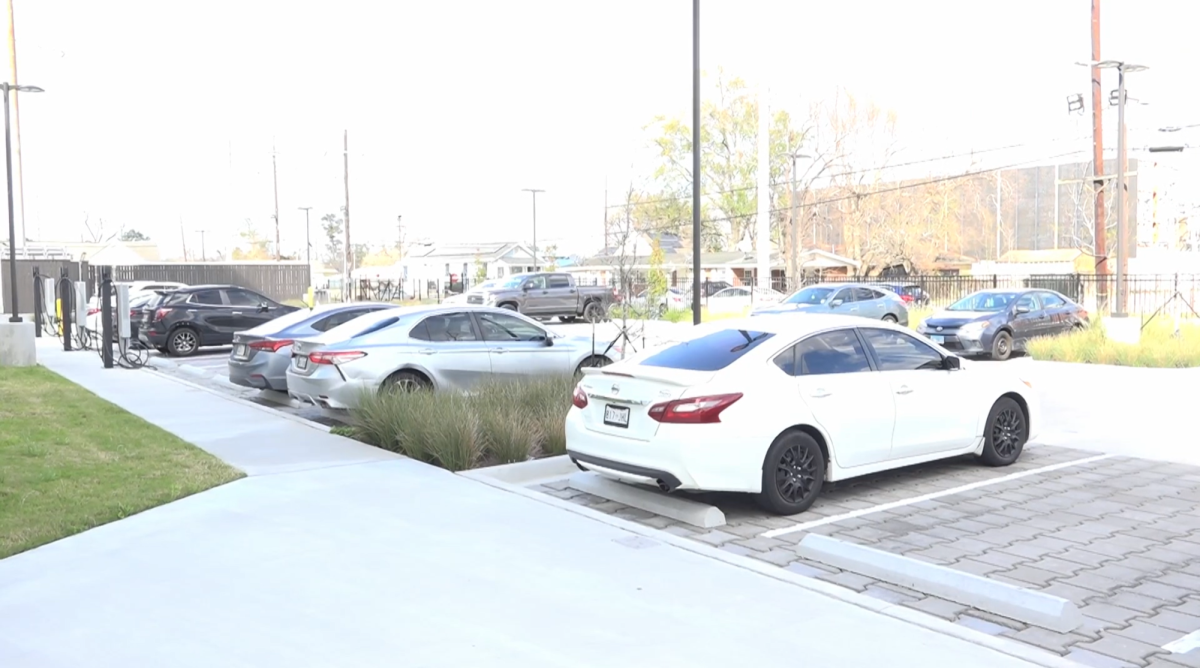 Student's cars parked in the parking lot at the Innovation Collective Residence Hall.